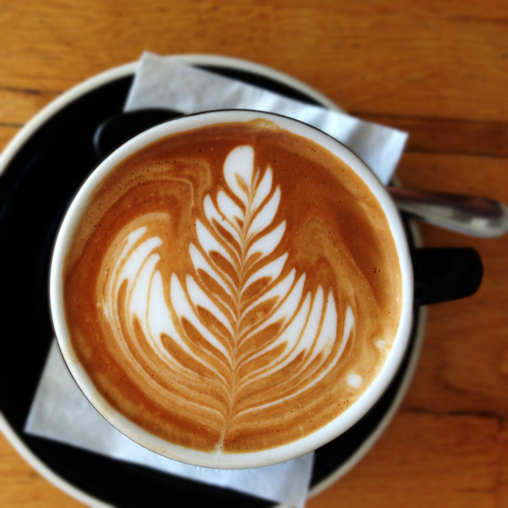 Barista prepared coffee at Quest Burleigh Cafe